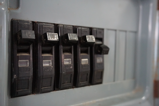 Five circuit breakers in a home.